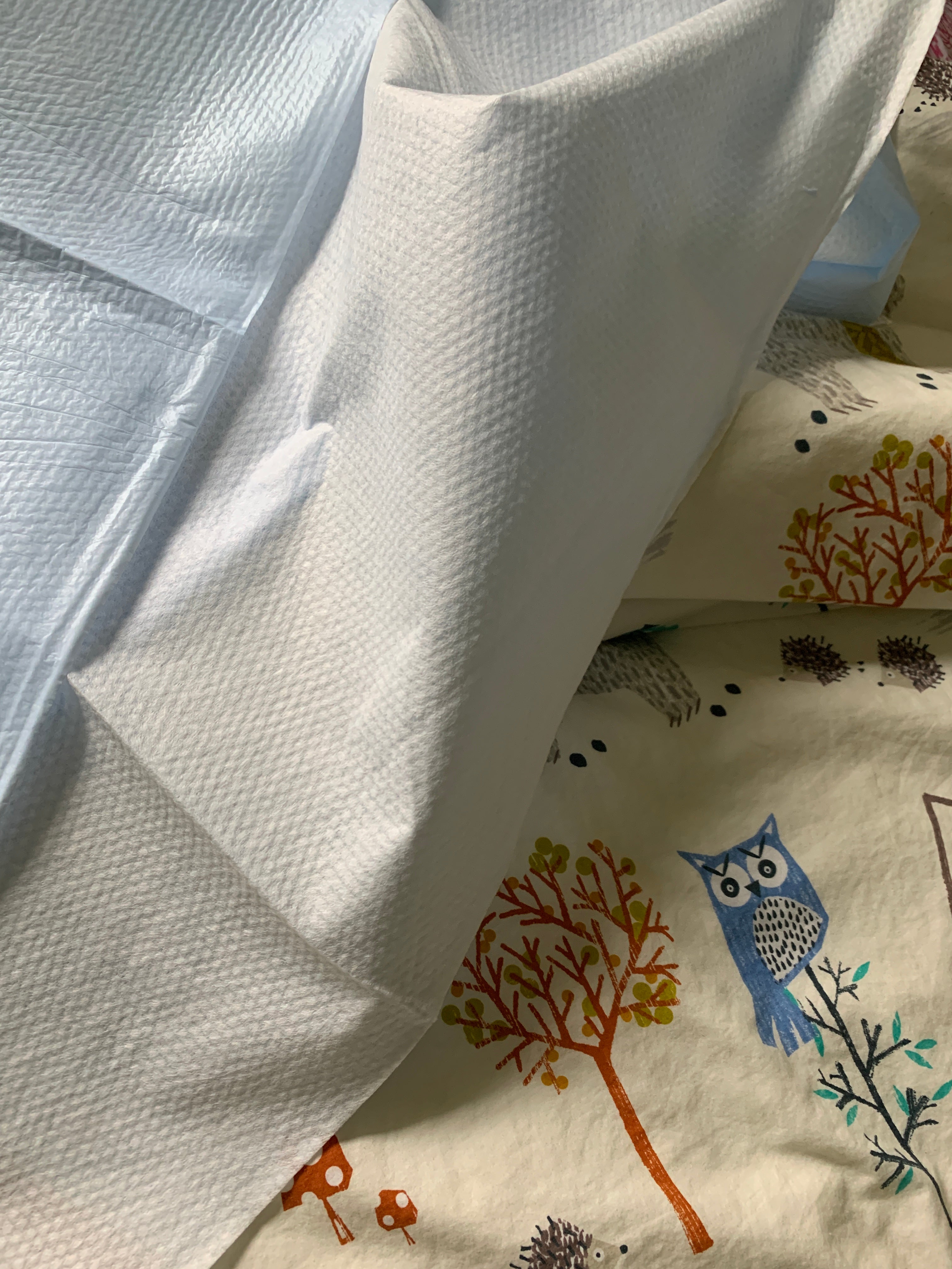 picture of a vommat covering a children's comforter on a bed